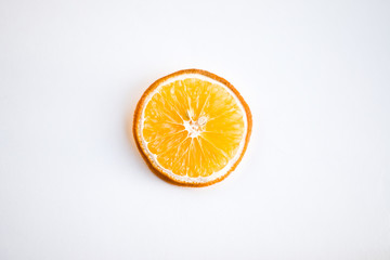 One Dried orange rings on white background