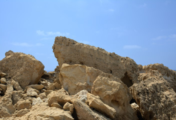 Fototapeta na wymiar big stones and pumice against the background of the sky