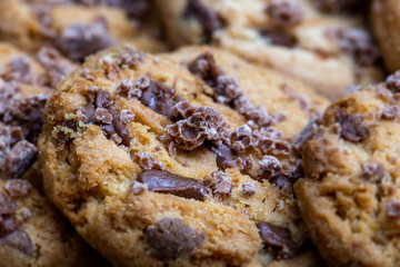 Details of a cookie with many drops of creamy and crunchy chocolate. Chocolate cookies.