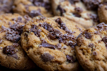 Details of a cookie with many drops of creamy and crunchy chocolate. Chocolate cookies.