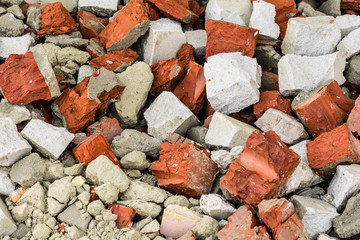 Shattered white and red bricks on the ground.