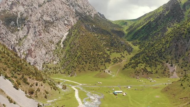 Murdash Village Alay Valley Kyrgyzstan Osh Region. A View of Alay Valley, Trans-alay Range, and Kyzyl-suu (West) River.  Alay Mountains. Murdash Village Is 100 Km From Osh City. Areal Dron Shoot.