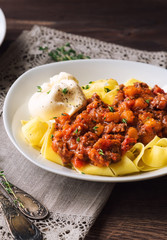 Pappardelle pasta with meat ragout and burrata cheese