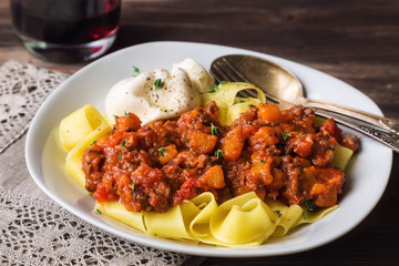 Pappardelle pasta with meat ragout and burrata cheese