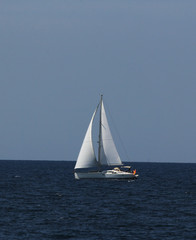 Sailboat on the blue sea