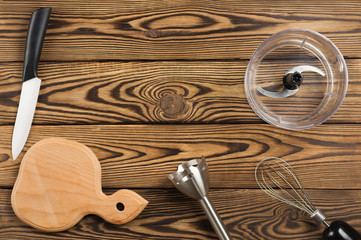 Kitchen equipment on old worn brown table. Top view with copy space