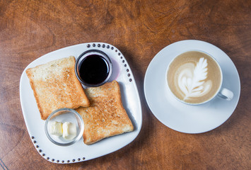 breakfast, toast with jam and butter on a white plate