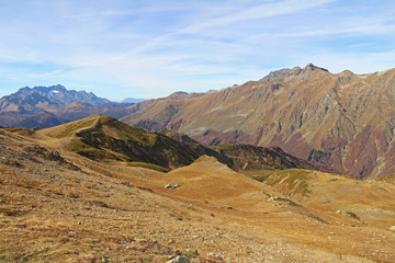 Panorama with yellow autumn hills and mountains. Abkhazia.