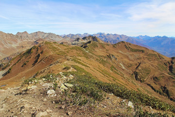 Panorama with yellow autumn hills and mountains. Abkhazia.