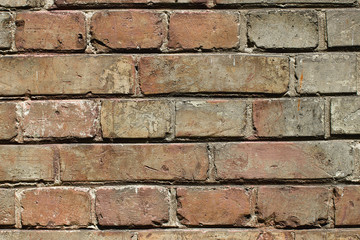 Red yellow brick wall with cement texture.
