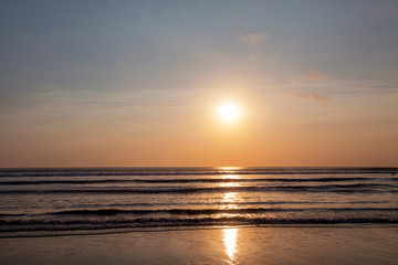 Fototapeta na wymiar Beautiful sunrise over the tropical beach