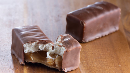 Chocolate candies on a wooden background. Close-up