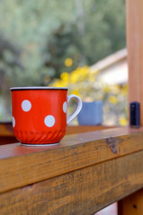 cup of coffee on wooden table. Countryside