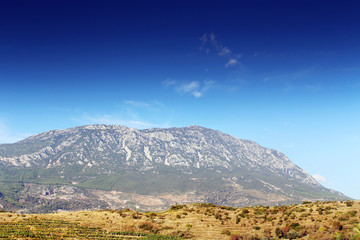 Landscape with mountains and blue sky