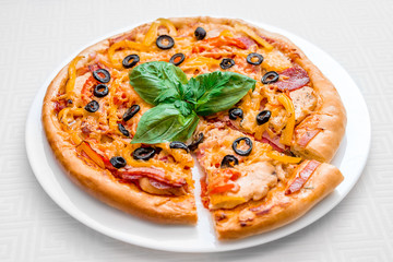 round pizza on a white plate