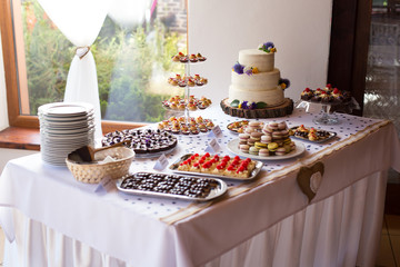 Wedding cake and small cakes