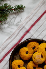 Obraz na płótnie Canvas Swedish christmas. Gluten free version Traditional swedish buns in christmas setting. A saffron bun, in Swedish lussebulle or lussekatt. 