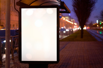 bus shelter, with advertising billboard light advertisement for advertising. outdoor advertising luminous in the night city. layout for advertising. empty white field. bus stop