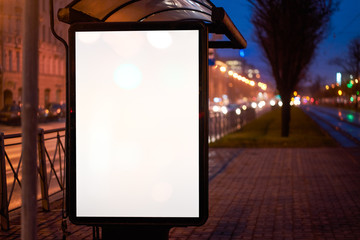 bus shelter, with advertising billboard light advertisement for advertising. outdoor advertising luminous in the night city. layout for advertising. empty white field. bus stop
