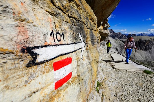 Hiker on the hiking trail 101 just in front of the Bullele-Joch-Hutte, Sextener Dolomiten, Alta Pusteria, South Tyrol, Italy, Europe