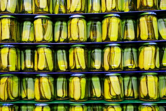 Pickled cucumbers in glass on pallet, Bavaria, Germany, Europe