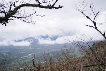 Rocks, bushes and fog in autumn Crimea mountains. Beautiful landscape.