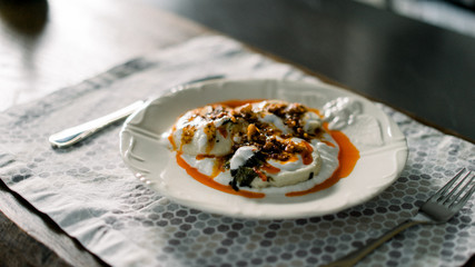 Ravioli with yogurt, paste, walnut and paste