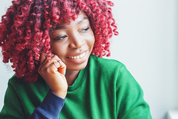 Charming African female looking with cute pensive smile