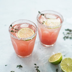 Cocktail with sicilian orange.Blood Orange Margarita in glass with salted rim.Top view