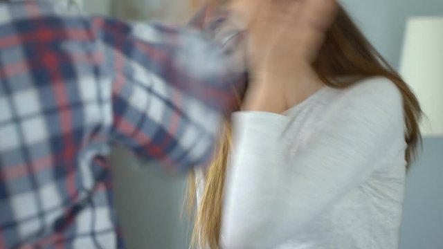 Man giving slap to woman, couple emotionally arguing, aggression in family