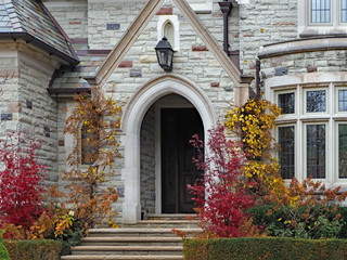 arched entrance to a gothic style stone house