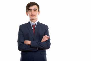 Studio shot of young handsome Persian teenage businessman with a