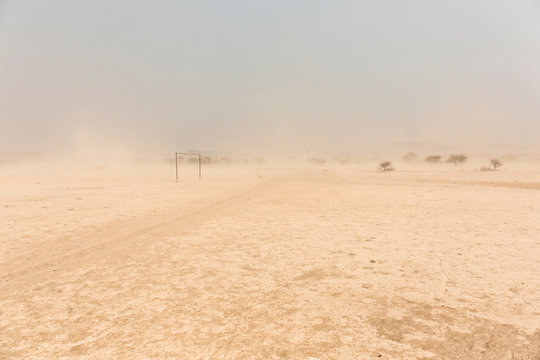 desert Soccer field in front of a white sand storm, Namibia, Africa