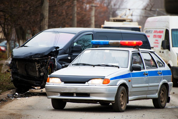 Police car and broken car with a shallow depth of field