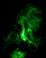 Green smoke on black background