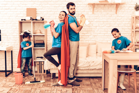 Cute Superhero Family Cleaning House With Kids.