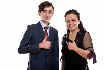 Studio shot of happy young Persian teenage businessman and matur