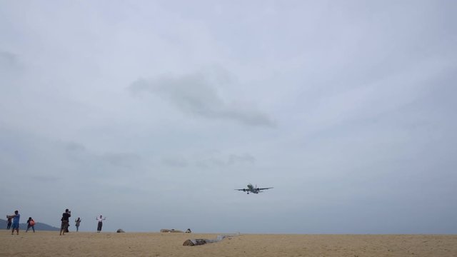 Passenger airplane landing over sea in summer season