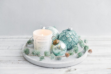 Tray with christmas decorations and candle