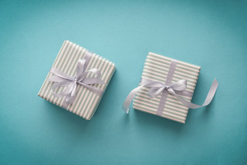 Several gift striped boxes with grey ribbon