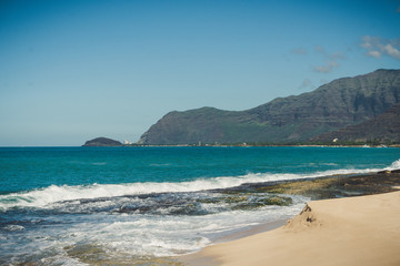 Beach and mountain view of the Island of Oahu