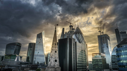 Desaturated aerial view of skyscrapers of the world famous bank district of central London after dusk