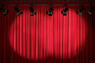 Red curtain or drapes background with lighting.