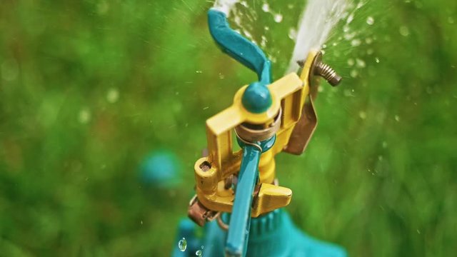 Working head of garden sprinkler in slow-motion