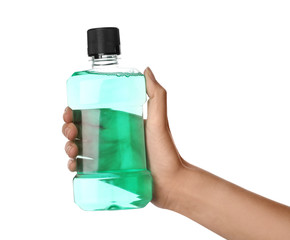 Woman holding bottle with mouthwash for teeth care on white background