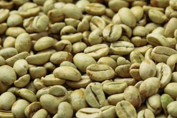 Many green coffee beans as background, closeup
