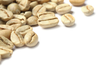 Green coffee beans and space for text on white background