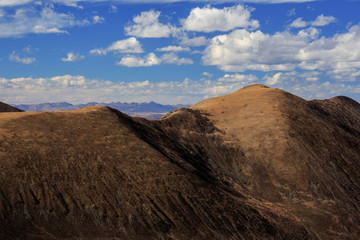 High altitude landscape, highlands near Xinduqiao - Ganzi Tibetan Autonomous Prefecture, Sichuan Province China. Chinese landscape - Yaha Pass at Gongga Mountain, Minya Konka. Rolling Hills, Blue Sky