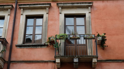 Taormina, Province of Messina, Sicily. Walking through the city, it is usual to see colourful houses. In this case, is remarcable the flower pots decoration.
