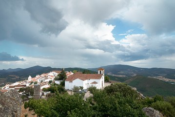 Fototapeta na wymiar Clouds over village of Marvão